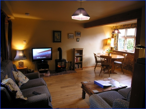 Lounge & dining area in Bossington Cottage
