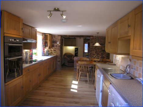 One of the two fully fitted kitchens with seating for 6 in The Stable Cottage